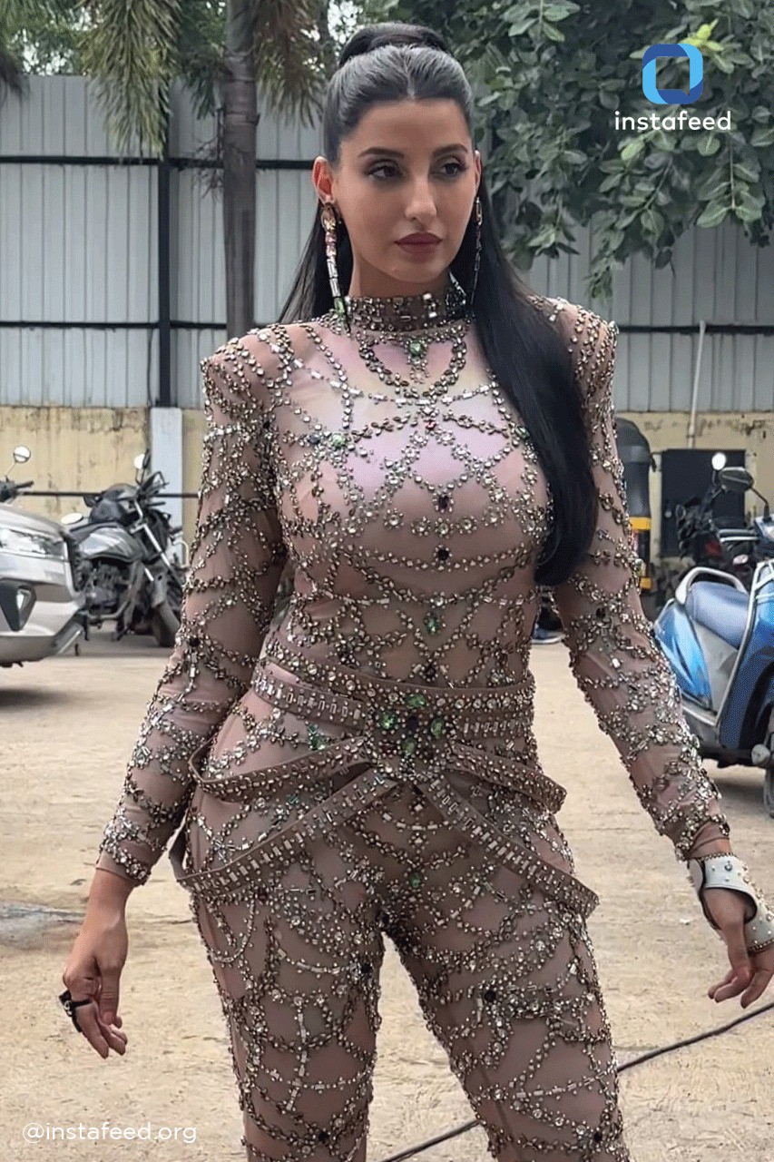 Nora Fatehi looks enchanting in baby pink blingy bodysuit with matching fur  coat, and statement accessories