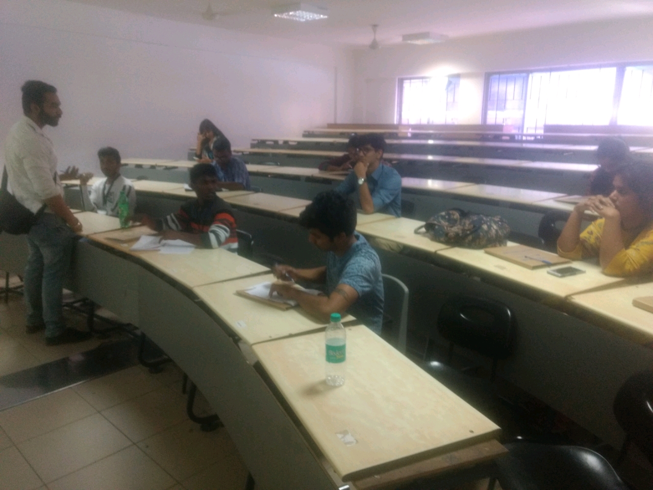 One place the students are concentrating and on the other he looks pretty h