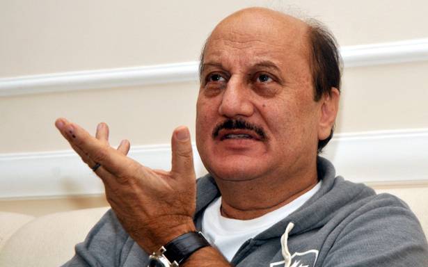 Standing for National Anthem shows person's upbringing: Kher